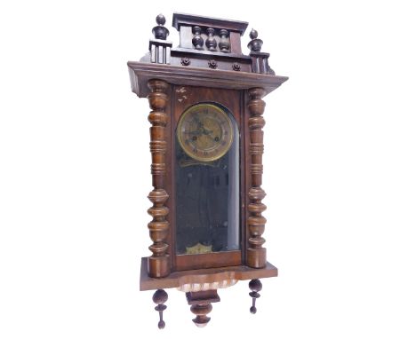 A late 19thC Vienna wall clock in walnut case, the dial with pressed metal centre and paper chapter ring, 83cm high. (AF) 