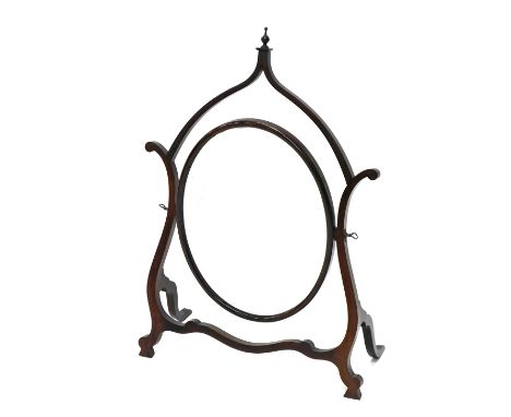 An early 20thC walnut Chinese Chippendale style dressing mirror, with a shaped frame and oval plate, 55cm wide. 