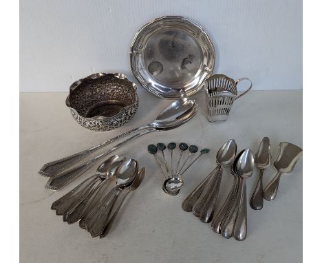 A miscellany of silverware to include an Indian silver bowl with wavy rim border and profuse embossed decoration, 11.5 cm dia