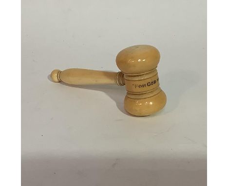 A 19th century carved ivory gavel, with turned handle, inscribed "For God and King". Length 12.5cm