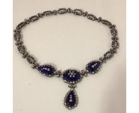 A striking vintage silver, enamel and paste necklace, hallmarked for London 1956, maker's mark HAL, of four shaped blue ename