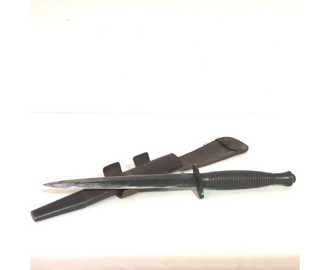 A World War II 3rd Pattern Fairbairn-Sykes 'B2' Commando fighting knife, the hilt with ribbed grip, the oval cross guard stam