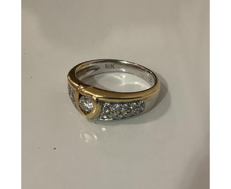 An 18ct gold diamond dress ring, set to the centre with a round brilliant-cut stone weighing approx. 0.15ct on a tapering ban