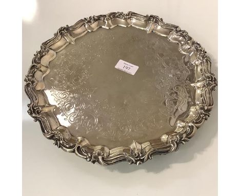 A Victorian silver salver, Joseph Angell II, London 1851, circular, the rim cast with scrolls and shells, enclosing a foliate