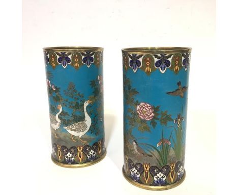 A striking pair of Japanese cloisonne enamel vases, c. 1900, of cylindrical form, one decorated with geese and birds amidst f