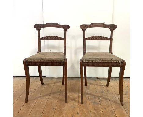 A good pair of Scottish Regency mahogany side chairs, c. 1820, each curved top rail with carved sash-end raised on Ionic supp