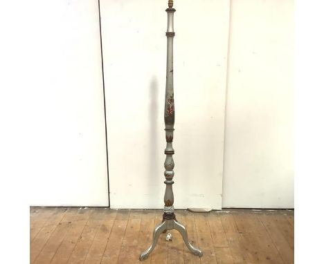 A silvered Chinoiserie standard lamp, early 20th century, all over decorated with figures and landscapes, on a tripod base. H