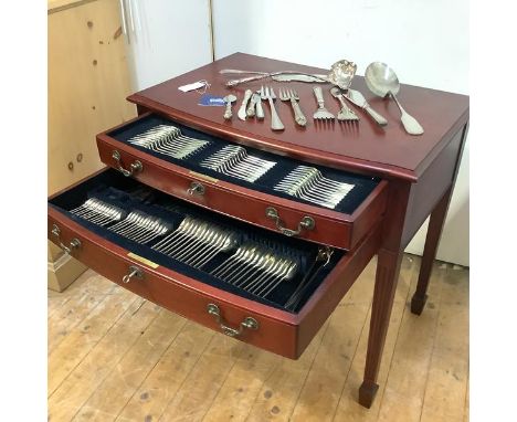 A table canteen containing a Hanoverian pattern silver flatware service, hallmarked for Harrod's Ltd, Sheffield 1988, of twel