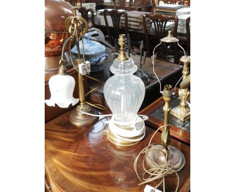 A brass Edwardian style table lamp and two others similar