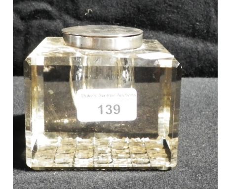 A silver lidded glass bodied inkwell