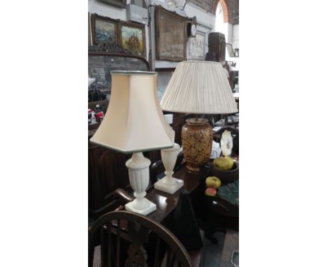 A ceramic bodied table lamp with pleated shade and two alabaster table lamps