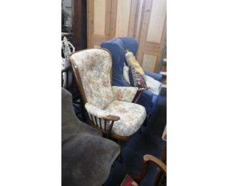 An Ercol beech framed armchair with removable cushions