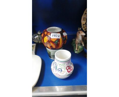A Poole pottery 'Delphis' type vase and another Poole vase