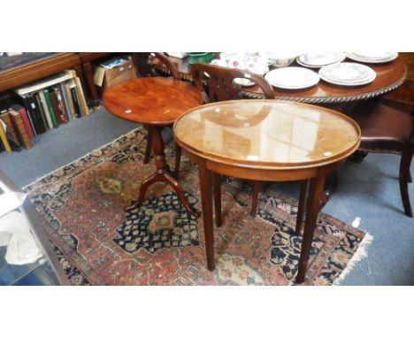 A 19th century mahogany tripod table with an oval top and a similar Edwardian table