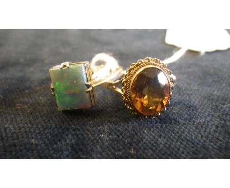 A citrine and 9ct yellow gold mounted solitaire ring and an opal doublet 9ct gold ring (2)