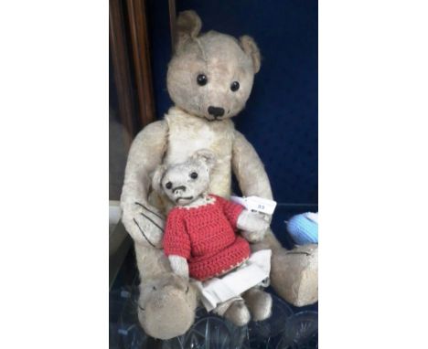 An early 20th century Teddy Bear (reputedly Steiff), the paws with four stitched claws, hump back and long limbs and another 