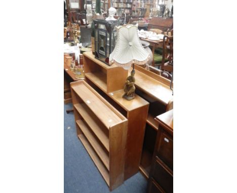 A set of light oak bookshelves and two similar