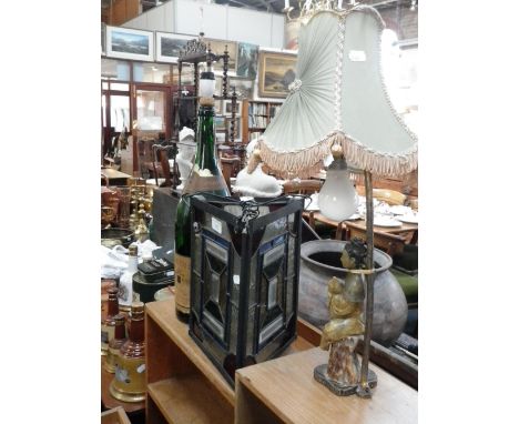 A hall lantern with leaded stained glass panels, an oriental style table lamp and a large champagne bottle (Pennrich 1874) co