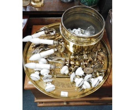 A collection of ceramic door knobs, door fittings, wall lights, a brass jardiniere and a brass tray 