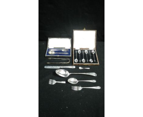 A cased set of six silver coffee bean spoons, a cased Sheffield silver spoon and fork christening set and a quantity of other