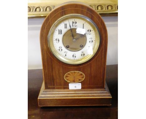 An Edwardian oak-cased mantel clock with fan inlay