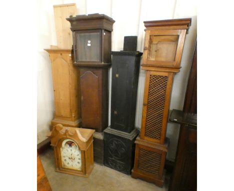 Three oak longcase clock cases and a pine longcase clock case 