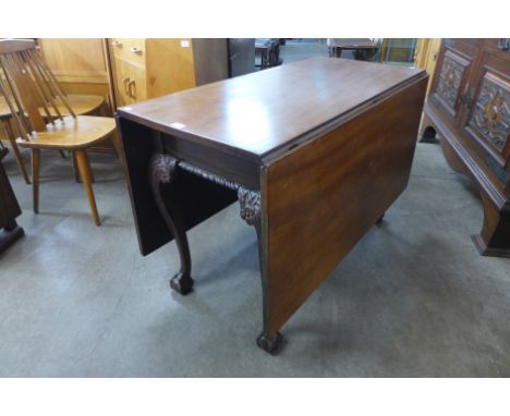 A George III style Chippendale Revival carved mahogany drop-leaf table 