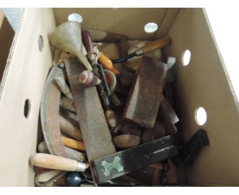 A box of vintage hand tools