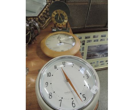 Two wall clocks and a mantle clock