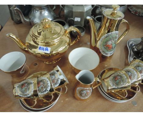 A gilt and transfer printed coffee and tea service 