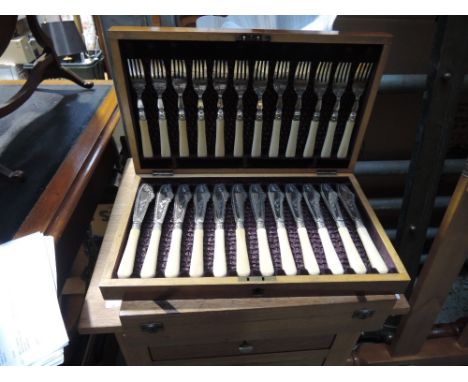 Two canteens of flatware and a selection of glassware