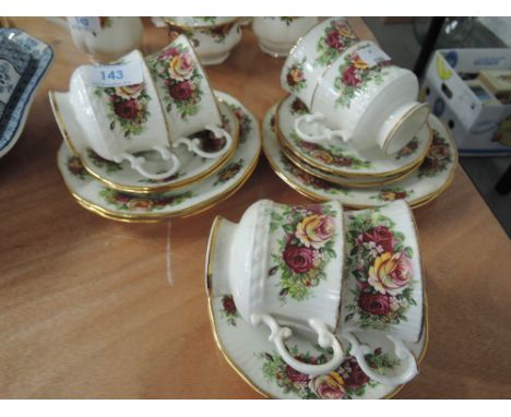 A part 'Elizabethan' tea service with gilt and rose decoration