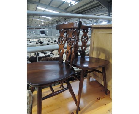 A pair of beech dark stained Ercol kitchen chairs
