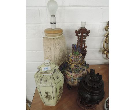 A Chinese style wooden carved table lamp, a pottery table lamp, A Dresdon lidded jar and two Chinese style lidded jars