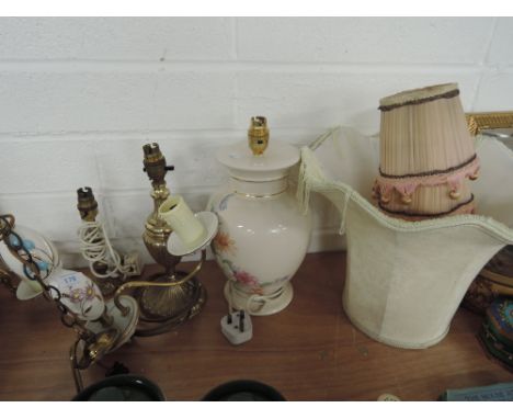 A light fitting, two brass table lamps and two ceramic table lamps with shades