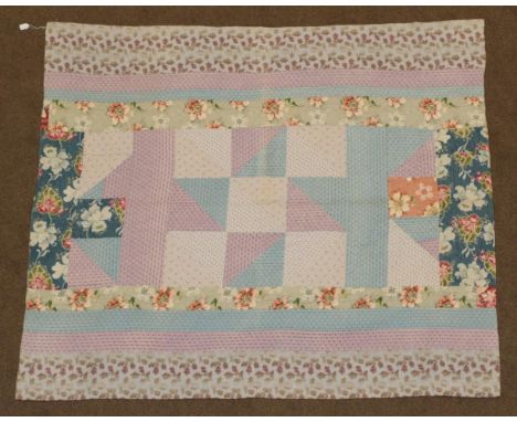 Circa 1920s Medallion Patchwork Quilt, incorporating earlier blue and mauve dress cottons, featuring a large star block to th