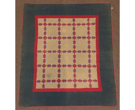 Circa 1890 American Amish Quilt, comprising a backing cloth of sage green, split by a trellis design of small nine patch squa