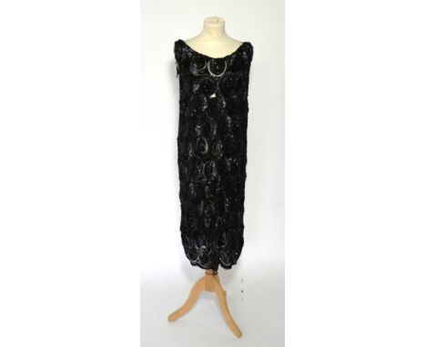 1920s Black Sequinned Sleeveless Dress, the net ground densely embellished with large spirals of small black sequins, each bo