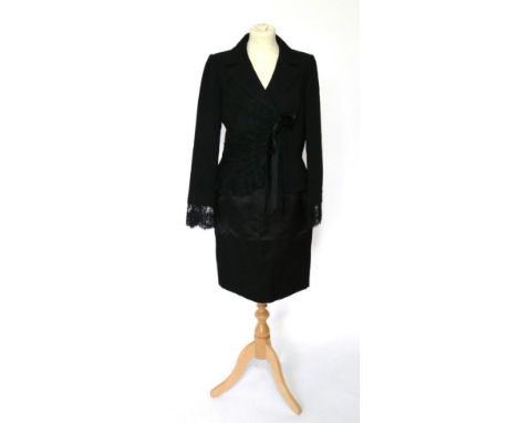 Chanel Black Silk Pencil Skirt, with zip and enamelled button fastening to the reverse (size 40); together with a Valentino B