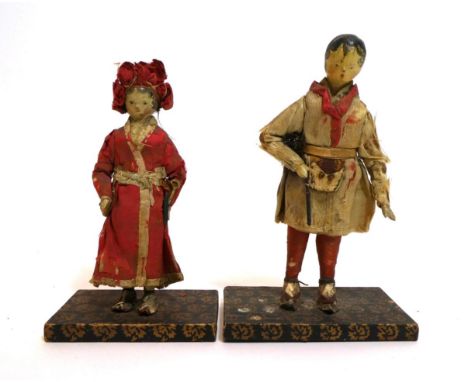 Pair of Early 19th Century Grodnertal Style Carved Wooden Dolls, with black painted hair, curls to the face, carved noses, pa