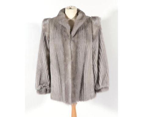 Light Grey Mink Jacket, or ribbed design with shoulder mounts, collar and gathered cuffs.    Slight wear