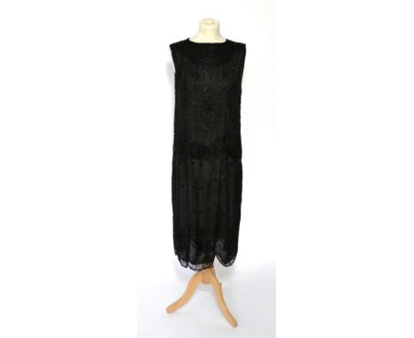 Circa 1920s Black Net Shift Dress, with black bugle bead decoration overall in scalloped design, with similar shaped hem