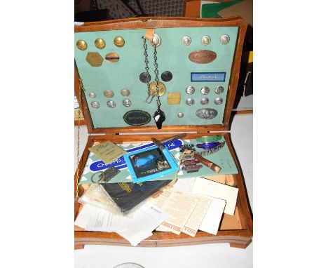 Wooden table top cabinet containing various assorted railway related badges, a card sign marked 'Chapel &amp; Wakes, Colne', 