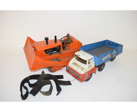 Vintage Tri-ang metal truck together with a vintage plastic bodied battery operated bulldozer
