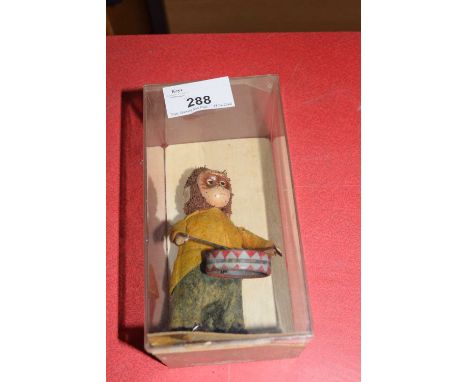Vintage clockwork toy monkey which plays a drum, approx 10cm high