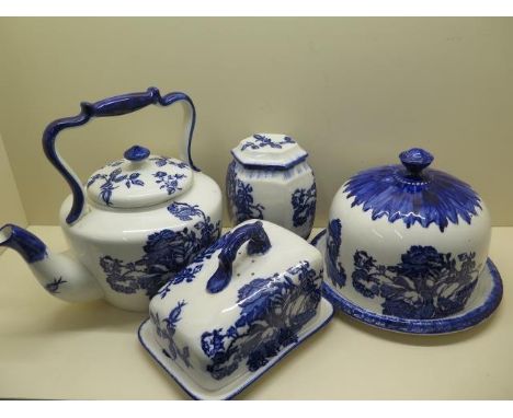 A Staffordshire Ironstone cheese dome and stand, decorated with blue roses against a white ground and stamped BLAKENEY to the