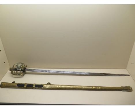 A 19th century French Grenadier officer's sword by Klinyenthal, with brass scabbard, the double fullered blade 94cm long, som