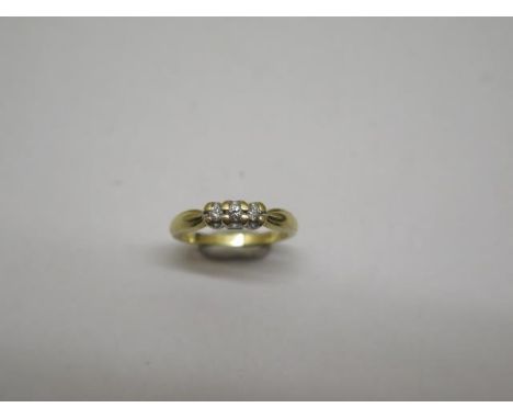 A hallmarked 18ct yellow gold three stone diamond ring, size K, approx 3 grams, some wear but generally good and diamonds bri