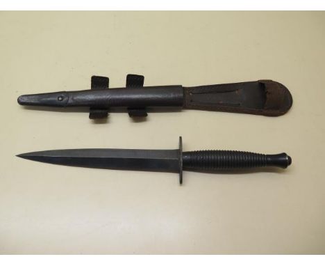 A 3rd pattern fighting knife with a leather scabbard, blade length 17.5cm, generally good condition, stamped to guard 