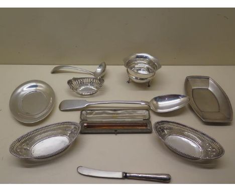 A collection of silver. A pair of Victorian bonbon baskets, an Edwardian Chester wavy edged bowl, a further basket, a butter 